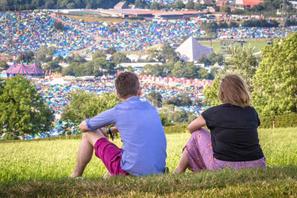 People looking over Glastonbury Festival